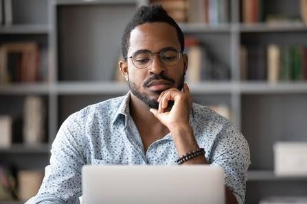 Man looking at an online course